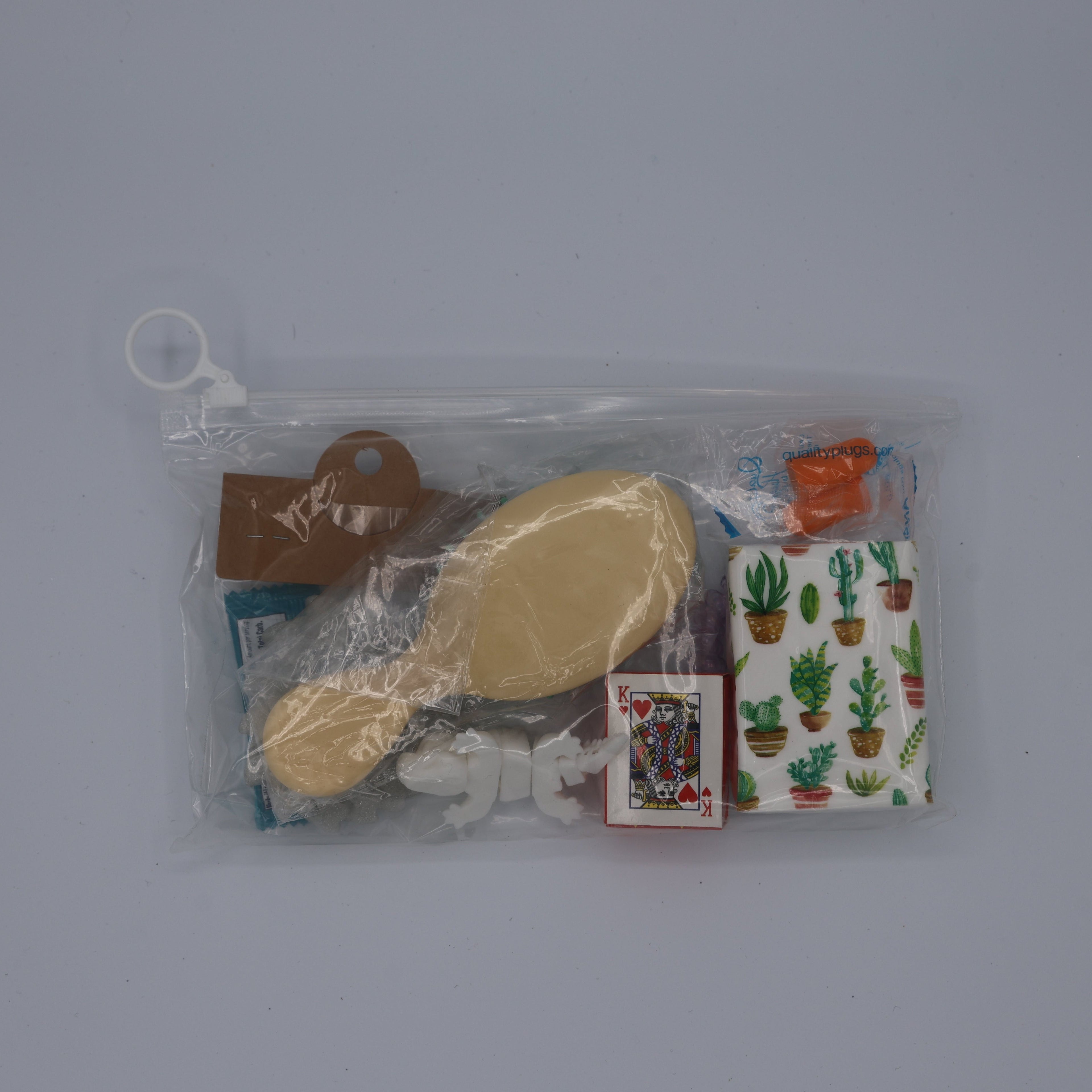 Packaged hairbrush and comb set with a small bag