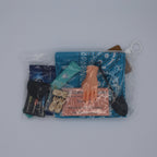 Collection of small items including a blue bag, a keychain, and a card