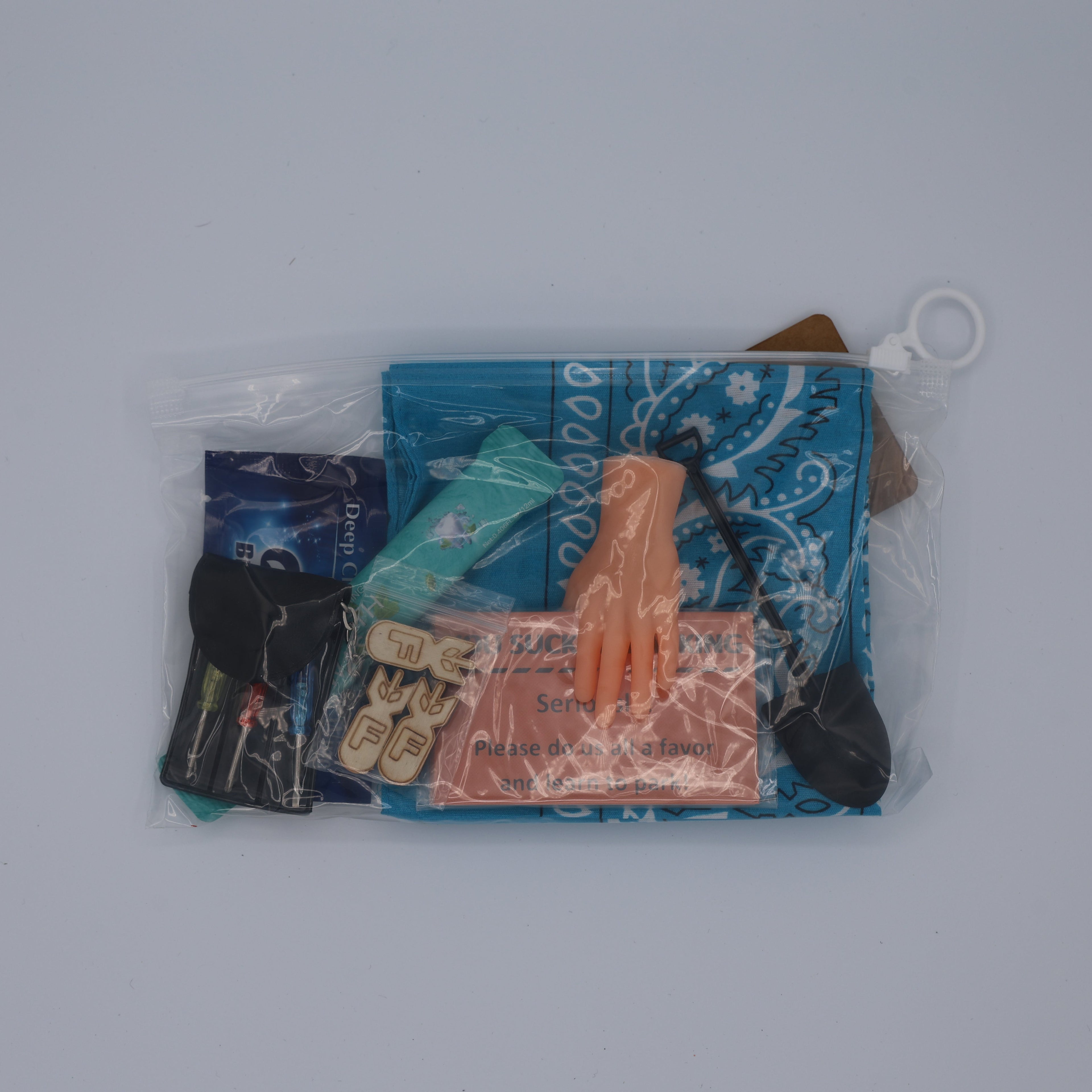 Collection of small items including a blue bag, a keychain, and a card