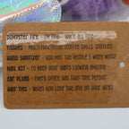 Tag with humorous office supplies list on a blurred background